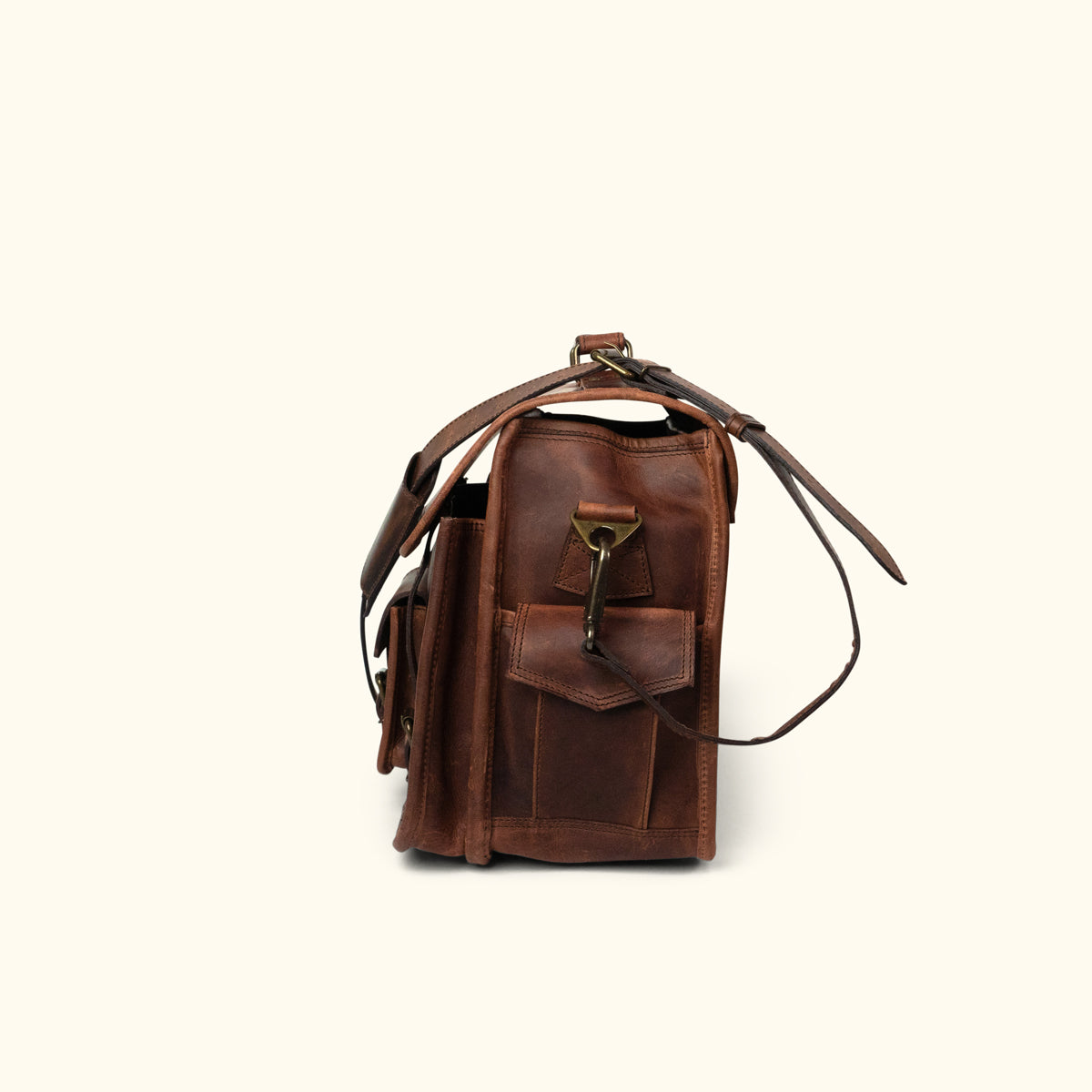 Men's Leather Briefcase Bag in Dark Oak, side angle view, featuring adjustable shoulder strap, secure buckle closures, and multiple compartments.